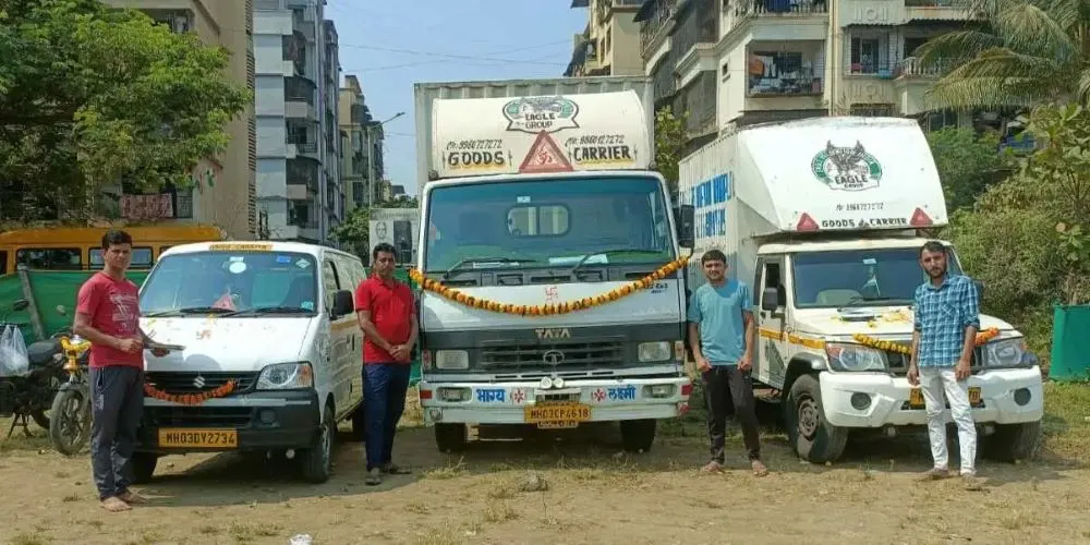 Packers and Movers in Panipat Team standing in front of moving trucks